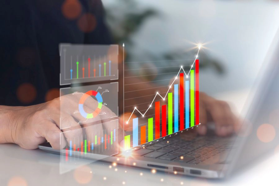 Businessman analyzing growth chart on virtual screen for business and financial decision making, strategy, data collection